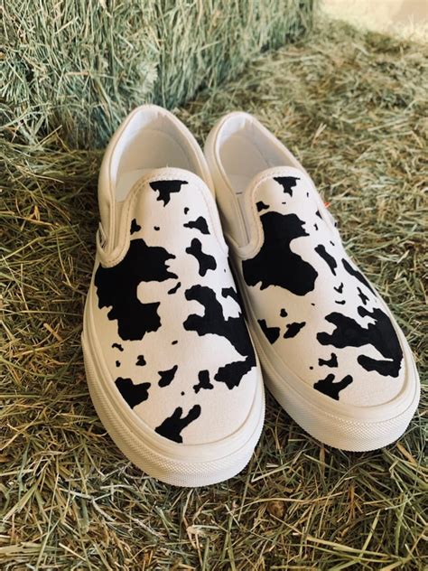 Cow Print Slip On Shoes by Vans: Fashionable Footwear Statement